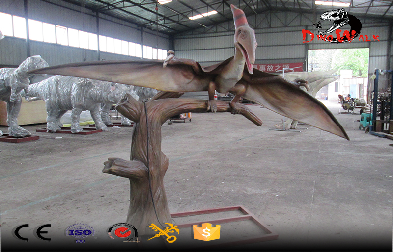 pterosaur animatronic dinosaur simulation standing on branch